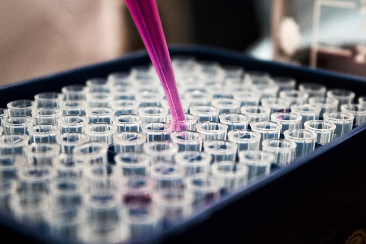 Pharmaceutical laboratory with molecular research visualization — AI drug discovery accelerates protein folding analysis and