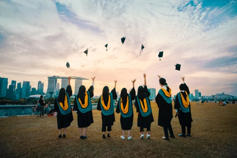 University campus with students using AI tools on laptops — how higher education institutions are leveraging AI for learning