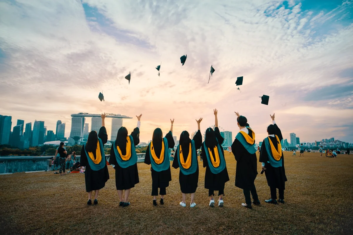 University campus with students using AI tools on laptops — how higher education institutions are leveraging AI for learning