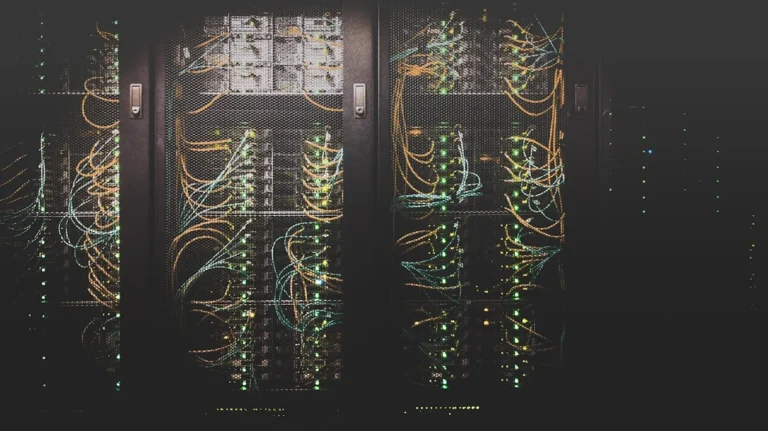 Server rack with network cables in data center — comparison of AI cybersecurity versus traditional firewall and signature-ba