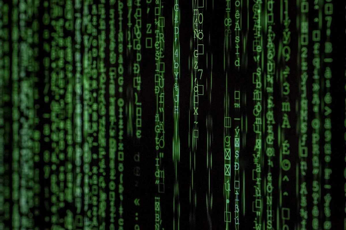 Binary code and digital lock representing AI zero-day attack detection — behavioral analysis catches unknown threats before
