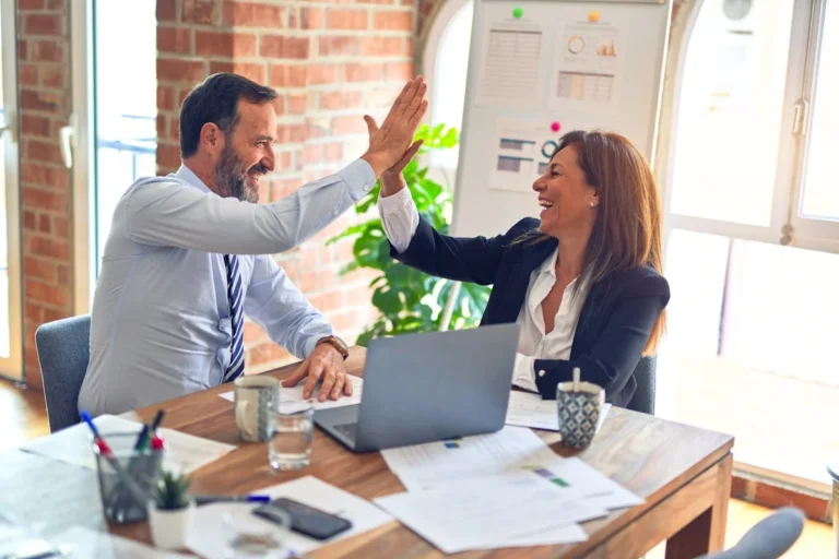 Freelancer using AI tools to prospect and find new clients on computer 2026