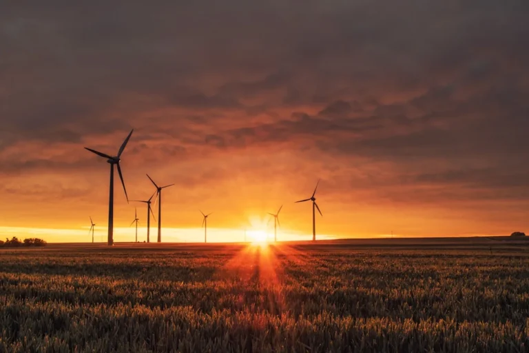 Wind turbines and solar panels with AI smart grid management system visualization 2026