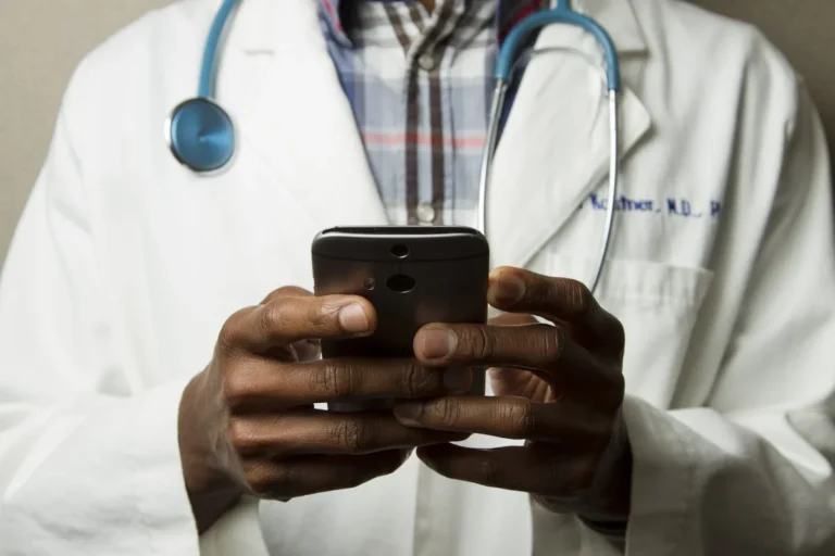 Doctor using AI diagnostic tools and medical imaging analysis system in hospital 2026