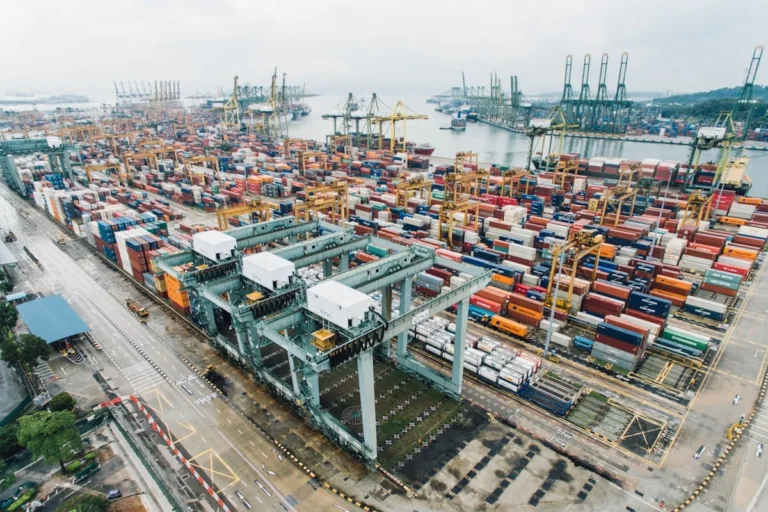 Modern logistics hub with AI-powered autonomous vehicles and smart route optimization 2026