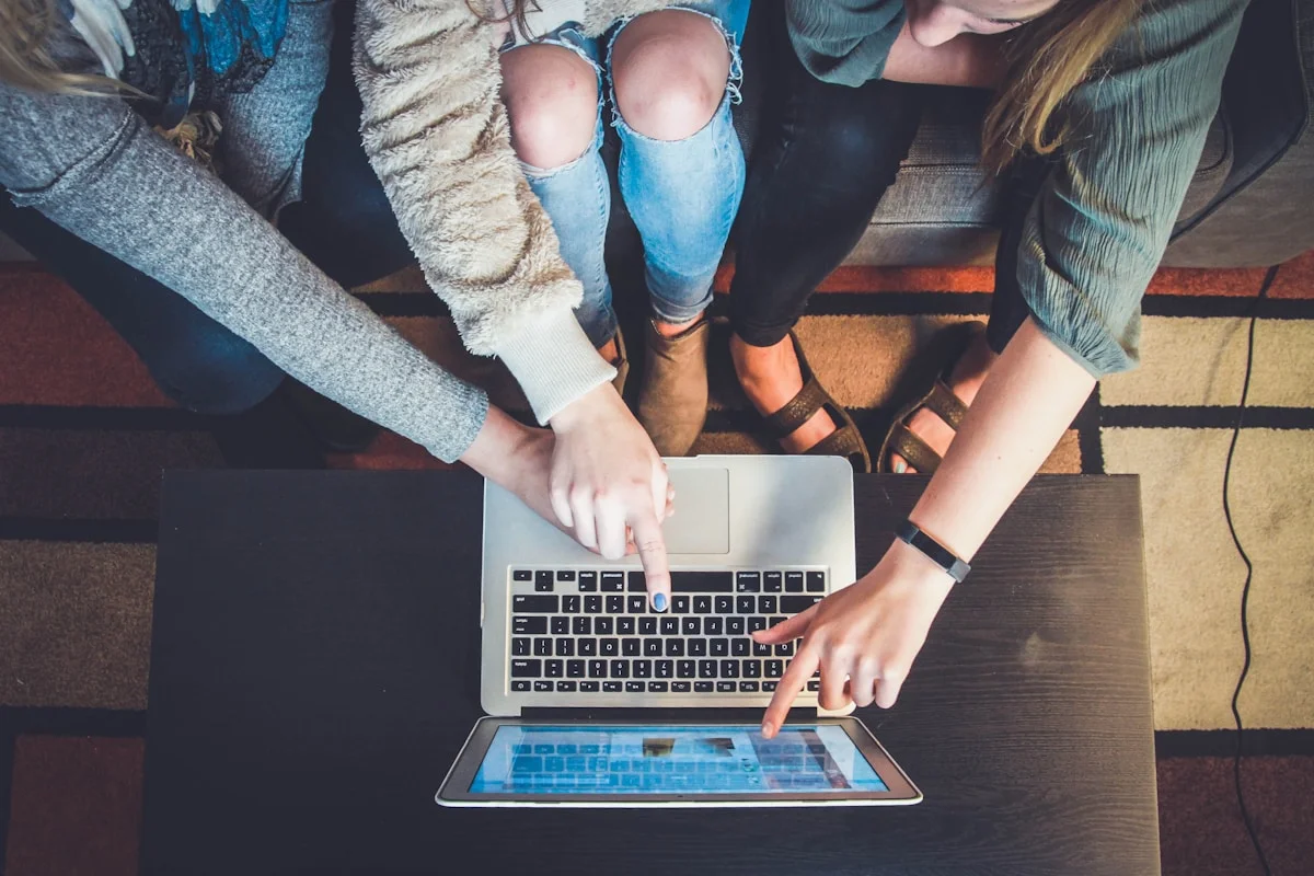 Remote worker using AI tools at home office showing meeting assistant documentation and async communication tools for distri