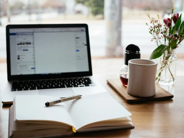 Student using AI study apps on laptop and phone for flashcards tutoring and research — best AI study apps comparison 2026