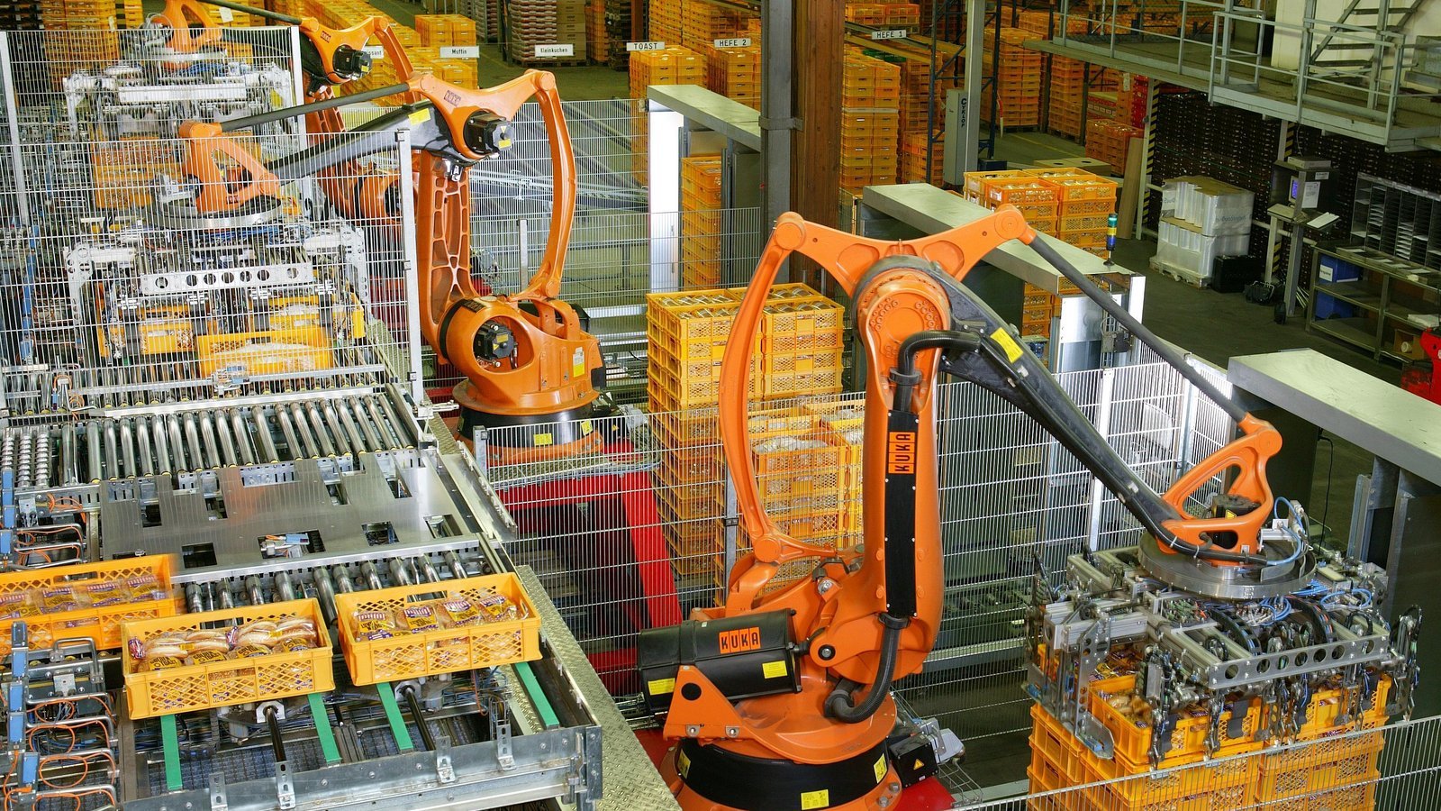 Industrial robots performing automated factory work
