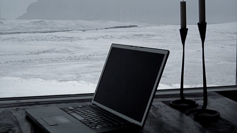 Laptop open alone on a table, representing solo freelance work