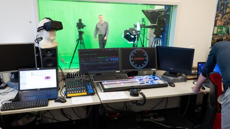 Television broadcast studio with green screen and production equipment