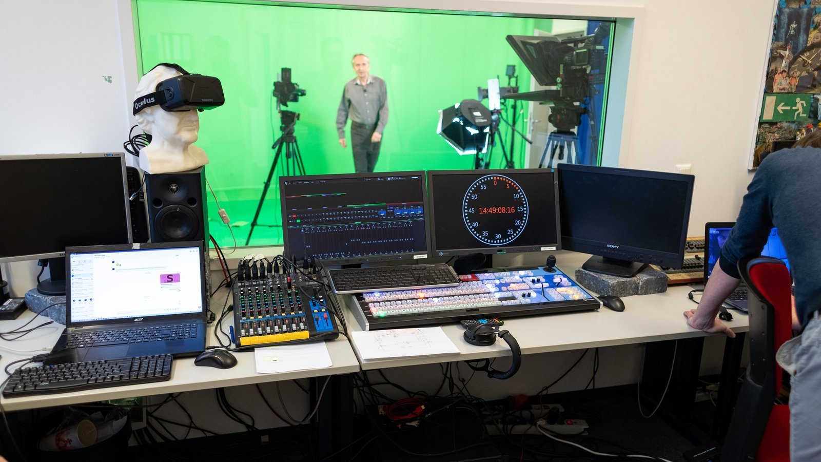 Television broadcast studio with green screen and production equipment