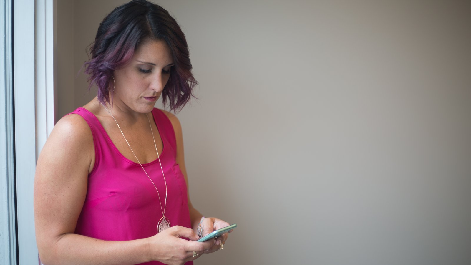 Woman texting and chatting on a smartphone
