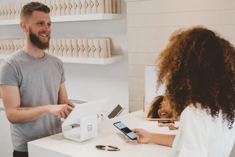 Shopify store owner reviewing AI-powered product recommendations inventory and customer service 2026